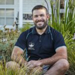 Close up of Luke in a native garden